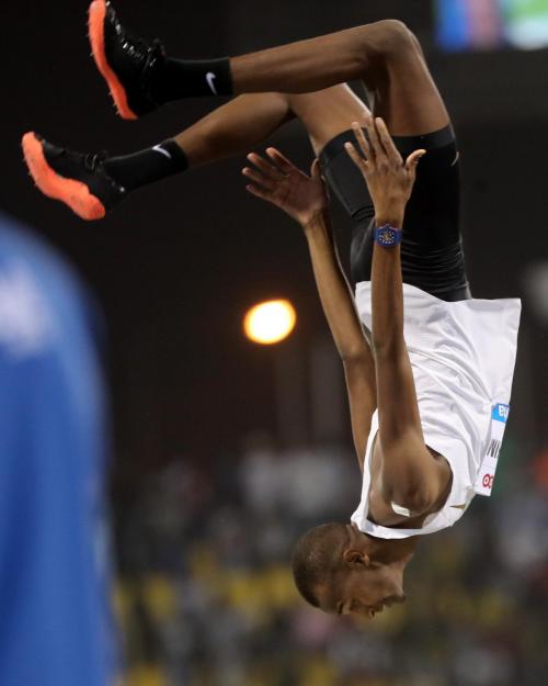 Mutaz Barshim flips to cheering crowds.jpg