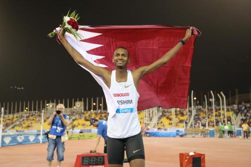 Qatari high jump superstar Mutaz Barshim smiles in front of a cheering crowd after defending first place at the Doha Diamond League.jpg