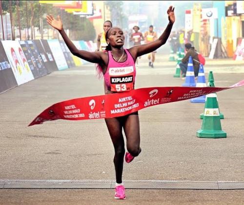Florence Kiplagat winning the Airtel Delhi Half Marathon 2013.jpg